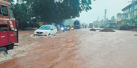 Vehicles plough through NH-66 in Bhatkal after heavy rainfall on Wednesday
