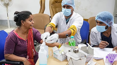 A relative of Air India plane crash victim gives her DNA sample