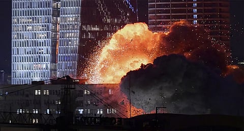An explosion is seen during a missile attack in Tel Aviv, Israel
