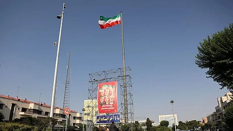 Pictures of those killed in Israeli strikes on Iran are displayed on a street, in Tehran, Iran.