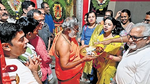 Residents of Holiday Village Road perform puja