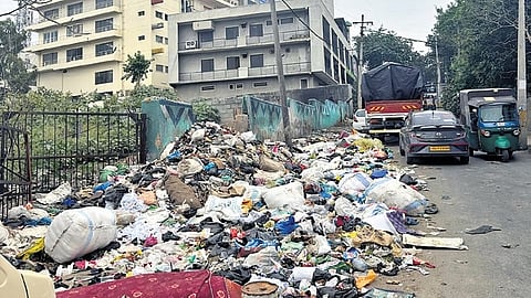 Garbage dumped near a vacant plot at Guddadahalli