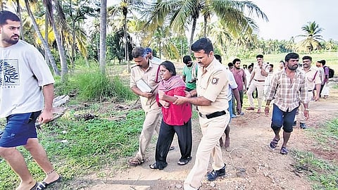 The law student Pavithra who jumped into Cauvery river being rescued by the officials.