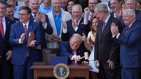 President Donald Trump bangs a gavel presented to him by House Speaker Mike Johnson of La.