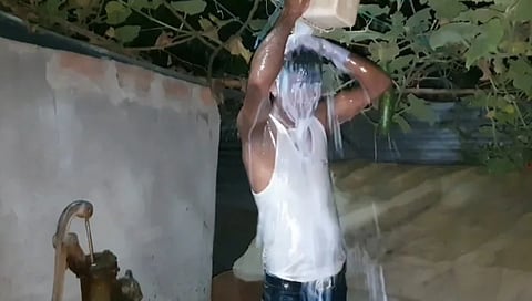 Manik Ali bathed in milk to celebrate his "freedom".