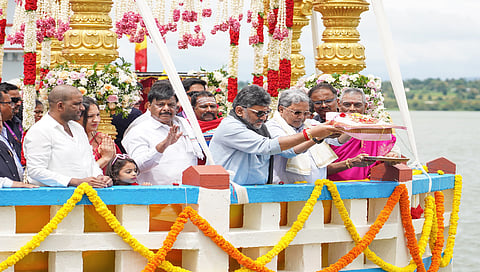 CM Siddaramaiah and DCM DK Shivakumar arrive to offer bagina at the Kabini reservoir in HD Kote taluk, Mysuru district, on Sunday.