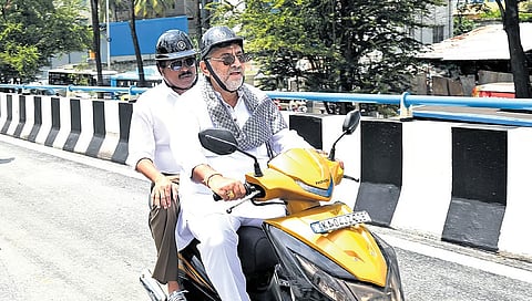 DK Shivakumar rides a two-wheeler