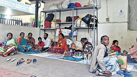 Attendants of patients admitted to Victoria Hospital take shelter at trolley bay.