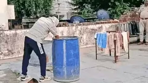 A man was found dead, stuffed in a drum on a rooftop in Khairthal Tijara district of Rajasthan. (X-@IndiaObserverX)
