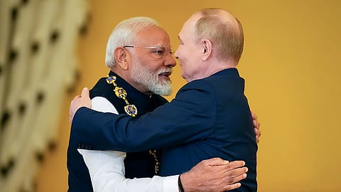 Russian President Vladimir Putin, right, awards Indian Prime Minister Narendra Modi