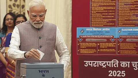 Prime Minister Narendra Modi casts his vote in the Vice-Presidential elections, at the Parliament premises, in New Delhi, Tuesday, Sept. 9, 2025.