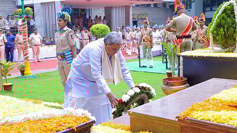 Karnataka Chief Minister Siddaramaiah places a wreath on a memorial to mark National Forest Martyrs Day in Bengaluru on Thursday.