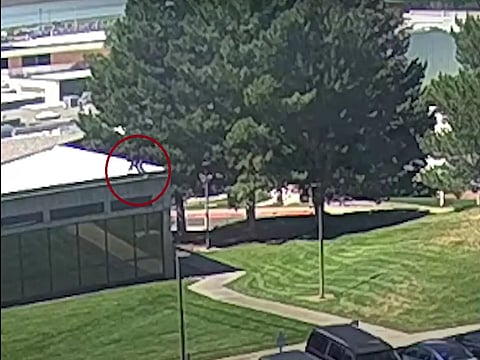 The CCTV footage showing Charlie Kirk's shooter jumping off the roof and feeling into the neighborhood.