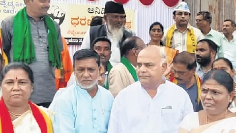 APMC Minister Shivanand Patil at the protest site in Vijayapura on Monday.