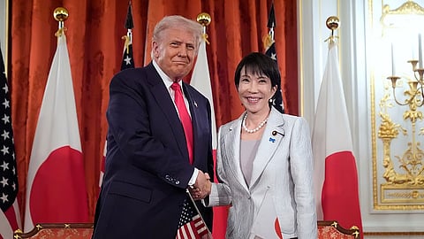President Donald Trump, left, and Japan's Prime Minister Sanae Takaichi shake hands during a signing ceremony at Akasaka Palace in Tokyo, Japan