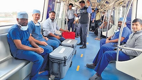 Doctors transport the lungs on a Metro train on Thursday