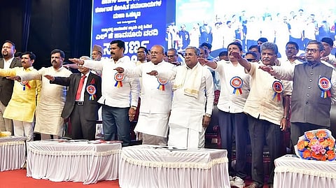 CM Siddaramaiah with other leaders at the golden jubilee of LG Havanur submitting the first backward classes commission report.

