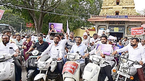 Vokkaligas take out a bike rally in support of DCM D K Shivakumar in Mysuru on Saturday.