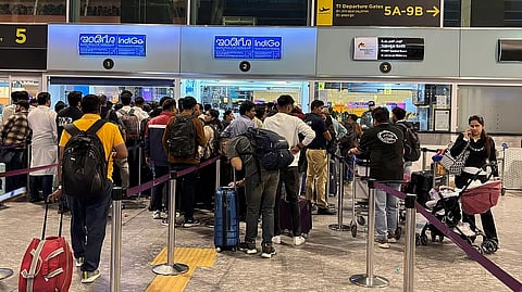 Travellers wait at IndiGo ticketing kiosks at Kempegowda International Airport in Bengaluru 