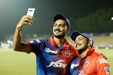 Prithvi Shaw with DC captain Axar Patel