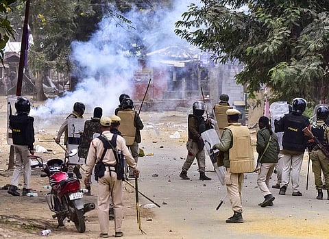 Security personnel deployed to maintain law and order after a clash between two groups over the issue of eviction, at Kheroni in West Karbi Anglong district, Assam