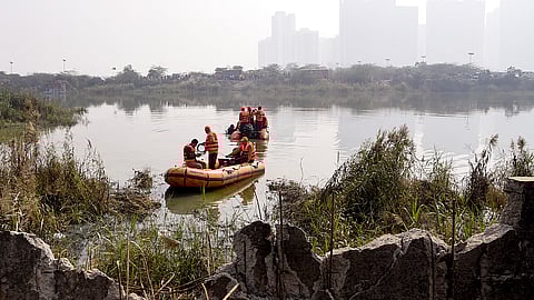 NDRF team commences operations in a water-filled pit at a construction site following the death of engineer who drowned there, in Noida