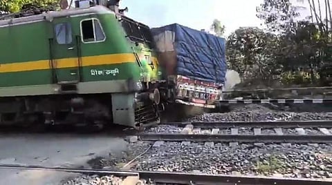 Express train rams truck at crossing