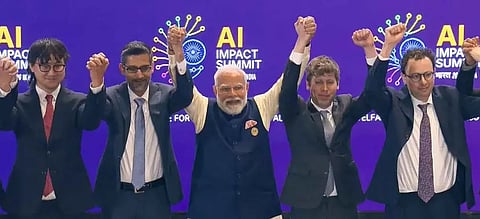 Prime Minister Narendra Modi, centre, joins hands with Google CEO Sundar Pichai, OpenAI CEO Sam Altman and others during the India AI Impact Summit 2026