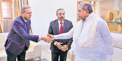 A delegation led by Tata Advanced Systems Chairman Banmali Agrawala greets Chief Minister Siddaramaiah in Bengaluru