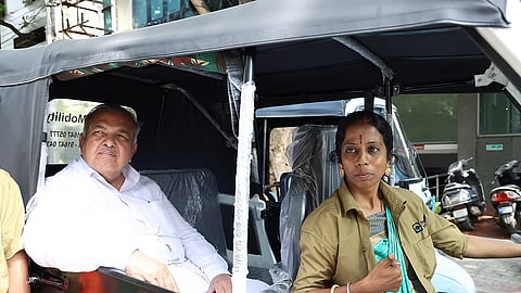Transport Minister Ramalinga Reddy takes a ride on an auto driven by a woman driver in Bengaluru on Monday.