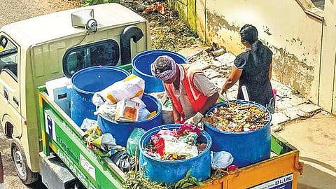 Sanitation workers collecting waste from residents Photo | M K ASHOK KUMAR