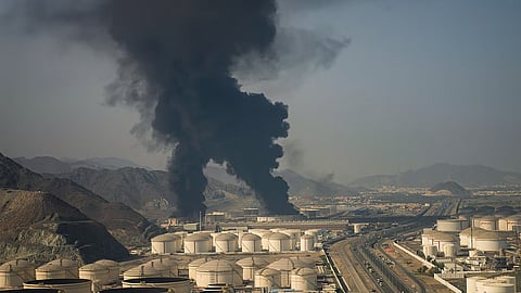 Fire and plumes of smoke rise from an oil facility in Fujairah, United Arab Emirates, Saturday, March 14, 2026.