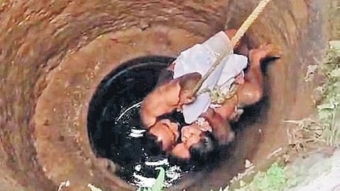 Payyu Chowti coming out of the well with two-year-old Bhuvi in Sirsi 