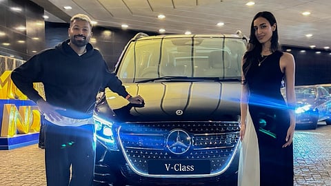 Hardik Pandya and Mahieka Sharma posing with the new car