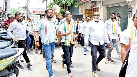 Congress candidate for Davanagere South Samarth Shamanur walks barefoot while campaigning in the city