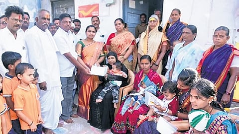 Certificates being distributed to the parents of the newborn girl in Hooli
