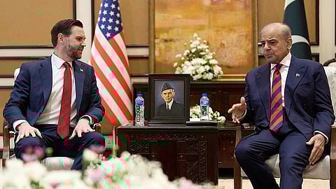 Pakistan pm Shehbaz Sharif (R) speaks with US Vice President JD Vance 