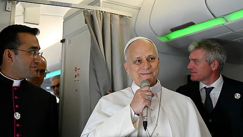 Pope Leo XIV speaks to journalists aboard his flight bound for Algiers’ Houari Boumédiène International Airport on Monday