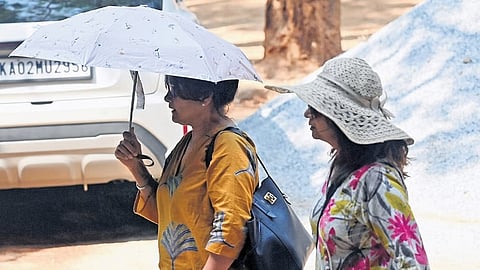 Two women brave the heat and step out in Bengaluru.