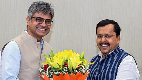 Rajya Sabha MP Sandeep Pathak (left) meets Nitin Nabin at the BJP headquarters in New Delhi.