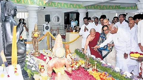 AICC chief Mallikarjun Kharge and his wife Radhabai light a lamp in front of a Buddha statue on the occasion of Buddha Purnima in Kalaburagi on Friday