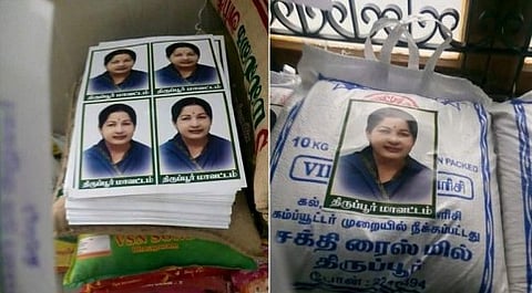 ಪರಿಹಾರ ಸಾಮಗ್ರಿಗಳ ಮೇಲೆ 'ಅಮ್ಮ' ಚೀಟಿ ಅಂಟಿಸಲು ಒತ್ತಾಯ
