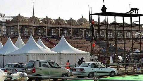 Workers make arrangements for the three-day World Peace Festival organised by spiritual guru Sri Sri Ravi Shankar in New Delhi on Wednesday.