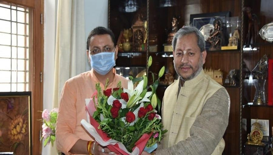 ಉತ್ತರಾಖಂಡ: ಮಾಜಿ ಮುಖ್ಯಮಂತ್ರಿ ತಿರಂತ್ ಸಿಂಗ್ ರಾವತ್ ಭೇಟಿ ಮಾಡಿದ ನಿಯೋಜಿತ ಸಿಎಂ ಪುಷ್ಕರ್ ಸಿಂಗ್ ಧಮಿ